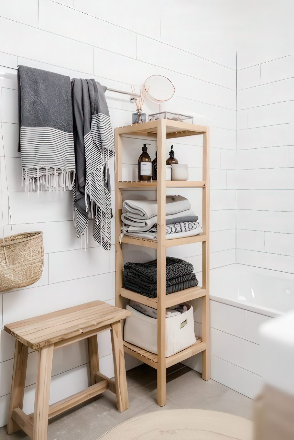 A minimalist wooden shelf with towels and various necessary bathroom stuff and railing for towels over it.