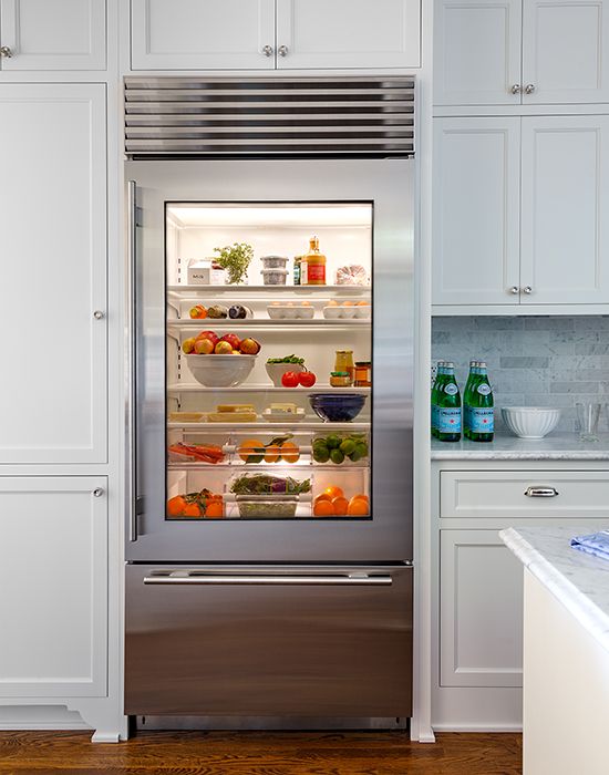 A stainless steel fridge with a clear glass door for showing off all the contents at its best.