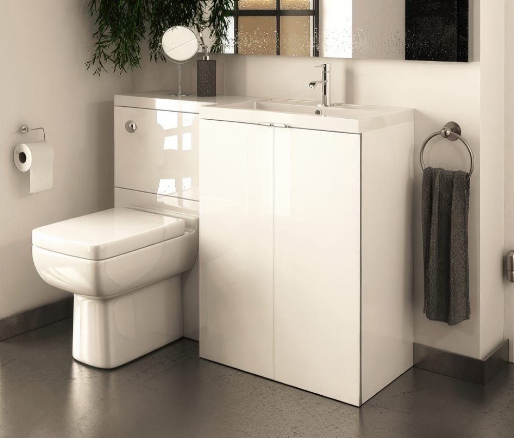 Modern white vanity, sink and toilet unit.