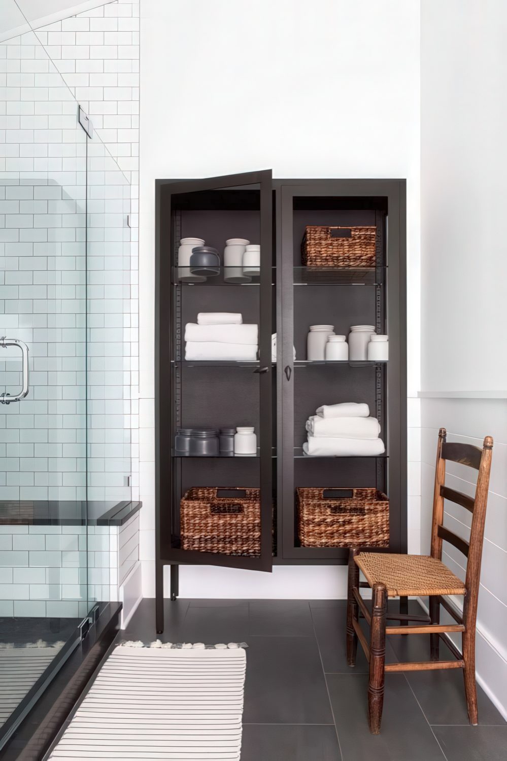 A glass closet with towels is a nice towel storage piece but it fits only a large bathroom.