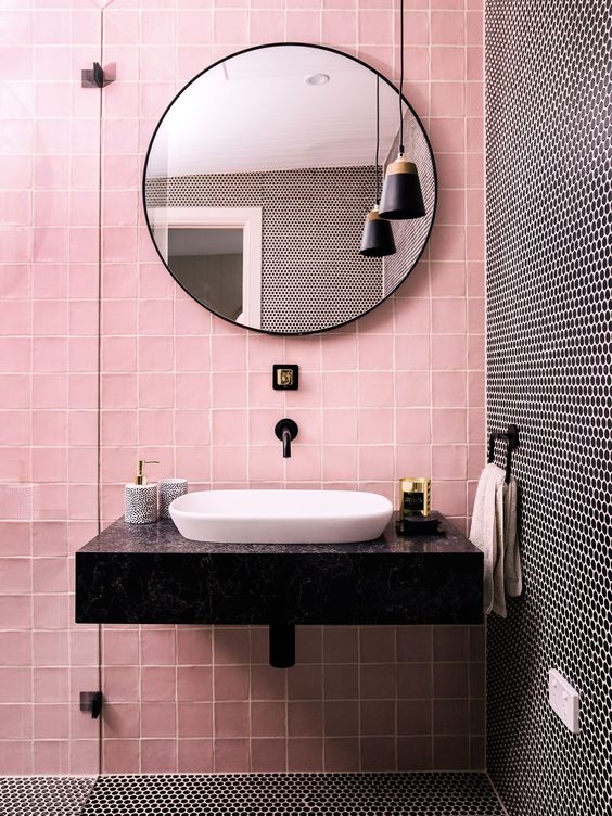 Pink and black penny tiles create a bold and chic combo for a modenr bathroom.