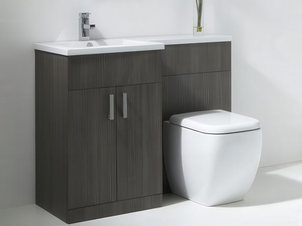 A basin and a toilet combined and clad with grey wood.