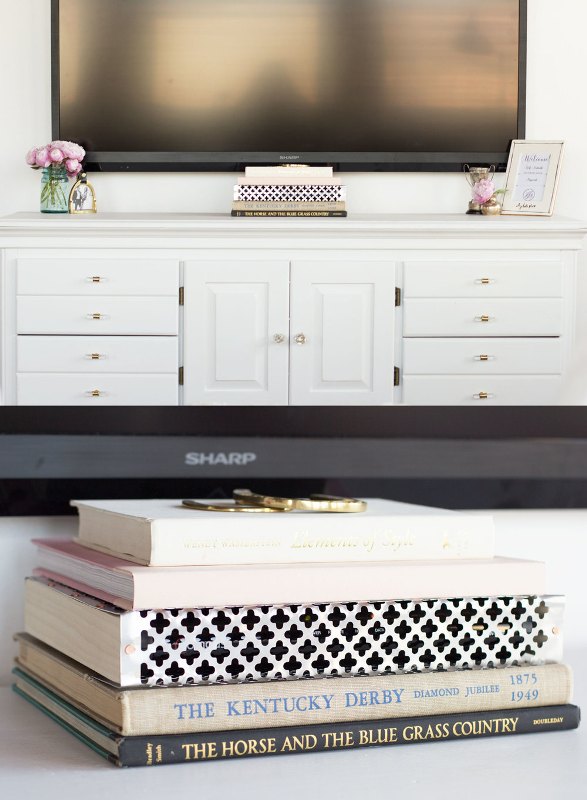 Cover your TV cords placing a stack of books strategically and making the space look sleek and elegant.