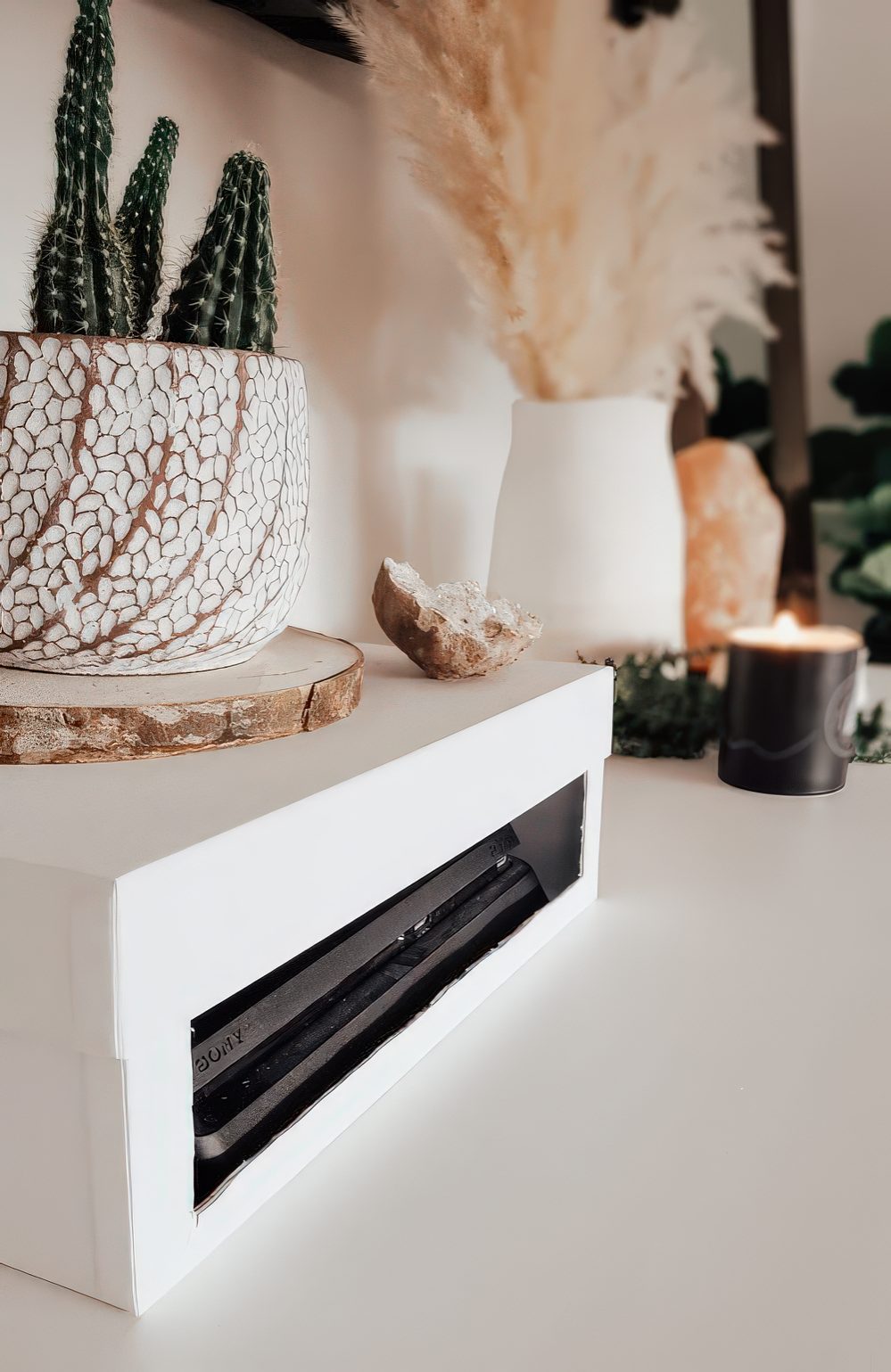 A box with a cutout is an easy and fast DIY solution to hide your wi-fi router without blocking the signal.