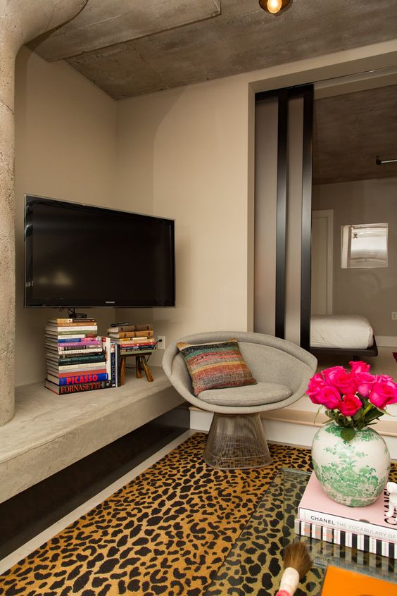 The easiest and fastiest way to hide the cords is to add some books - stacks of books will keep them out of sight in an elegant way.