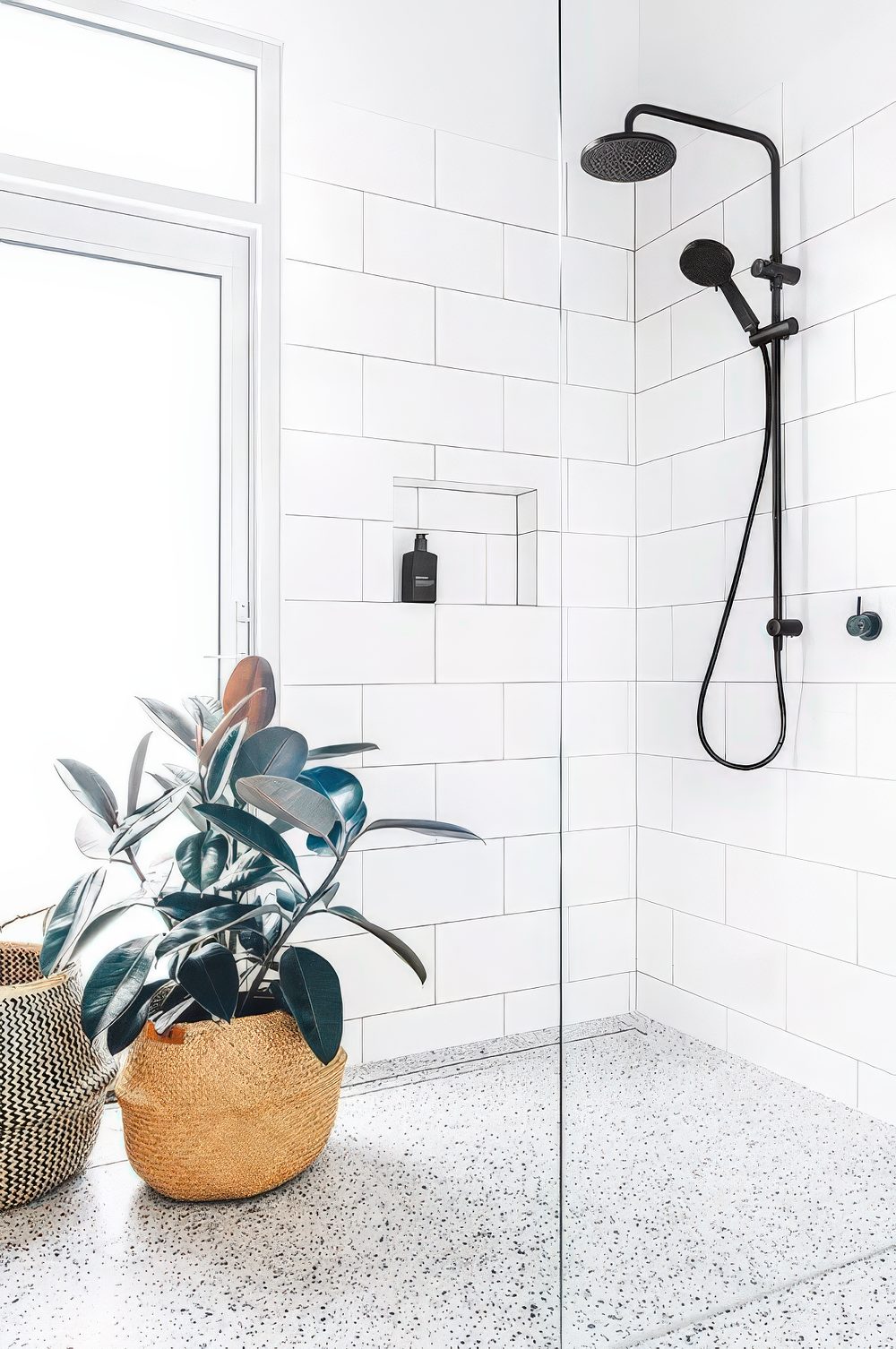 A tall window placed on the side and with potted plants to make the shower more private.
