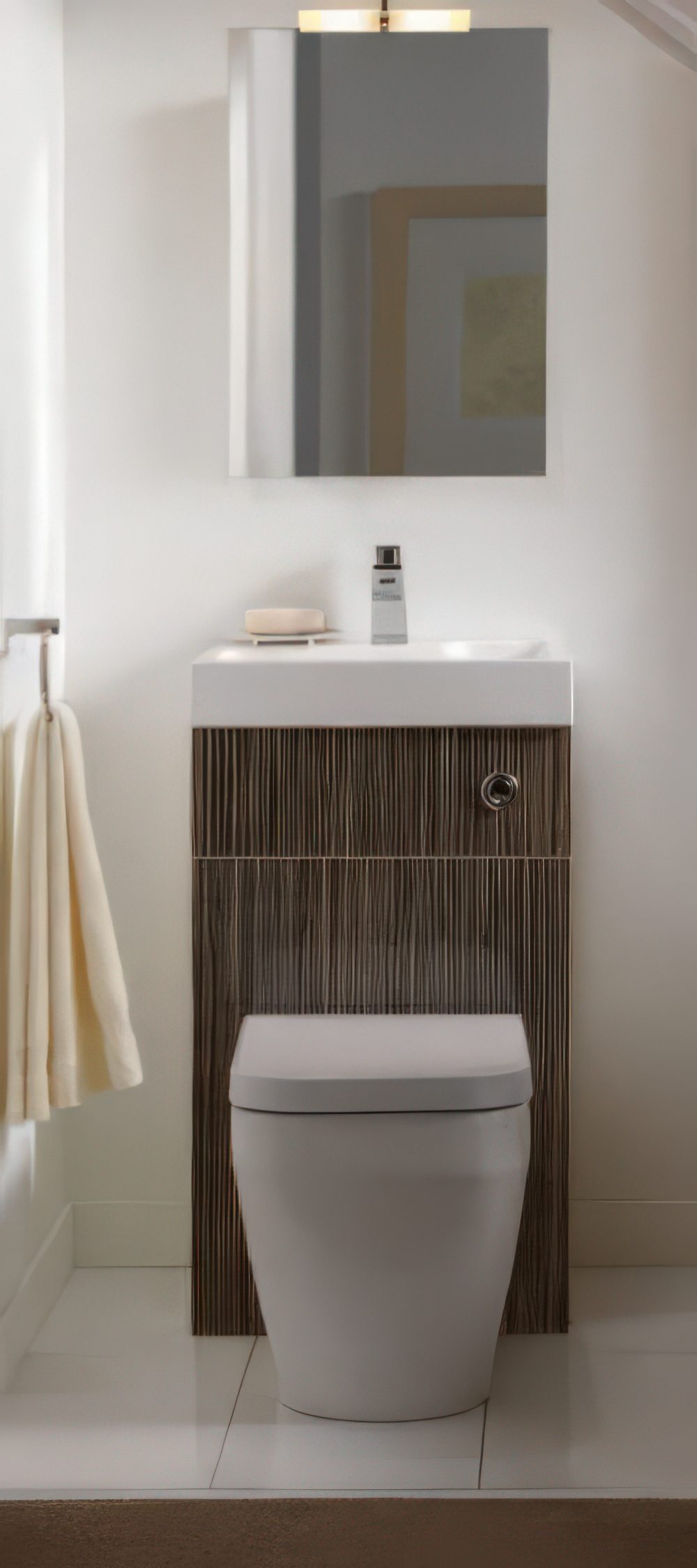 Toilet and sink unit decorated with bamboo-imitating tiles.