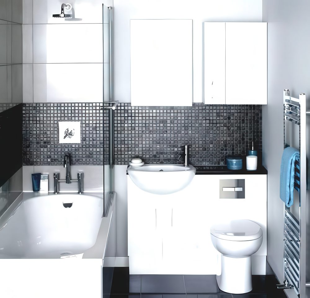 A sink and toilet combo with a black countertop.