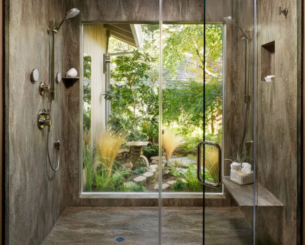 If you have your own garden with walls, going for a full height window in the shower is no problem.