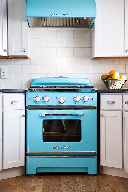 A retro bold blue stove and a matching hood to make a cool statement in your space.