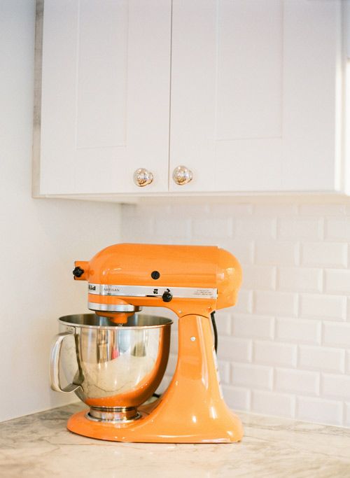 A kitchen aid mixer in bold orange to raise your mood while cooking.