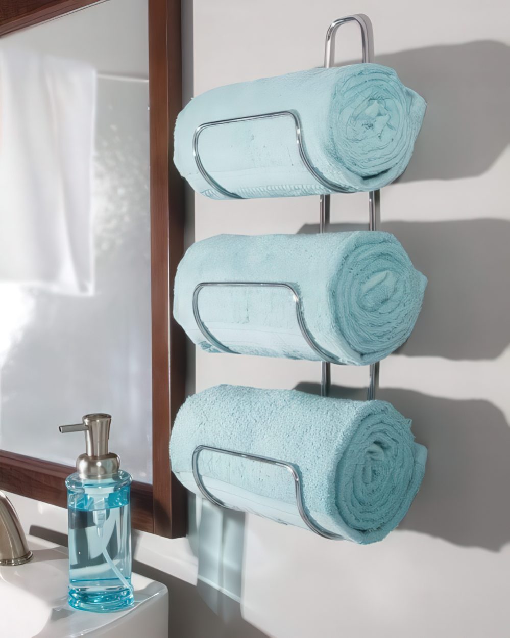 A stylish wall-mounted towel holder attached by the sink is a life changer that will save much space.