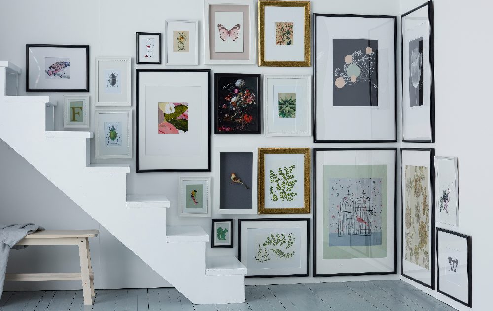 A staircase corner is fully taken with artworks and looks very spectacular, what a great idea.