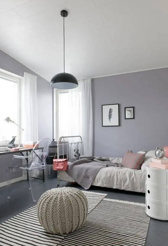 Create a modern teen girl bedroom with grey and lilac hues, highlighted by eclectic furniture. Neutral textiles and a pendant lamp complete the design. This room blends contemporary style with a personalized touch.