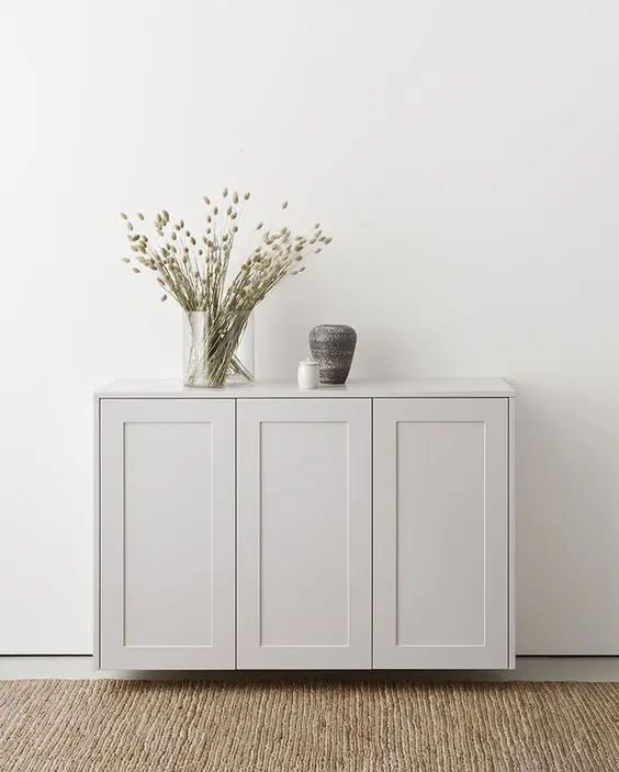 A pretty dove grey sideboard made of IKEA Metod cabinets, with pretty decor, is a cool and catchy idea.