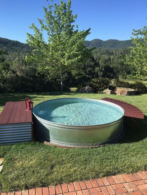 A round tank pool with a small deck with storage and another curved piece to relax on can be DIYed.