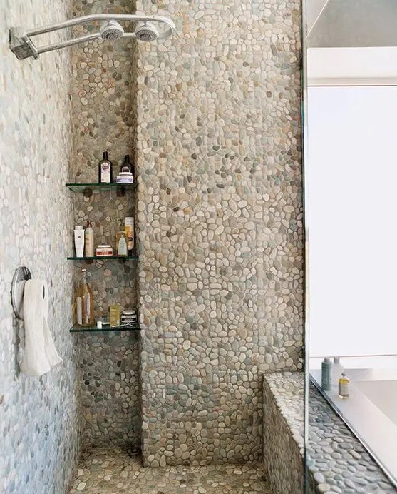 A shower space fully clad with pebble tiles will make you feel as if you are taking shower outdoors.