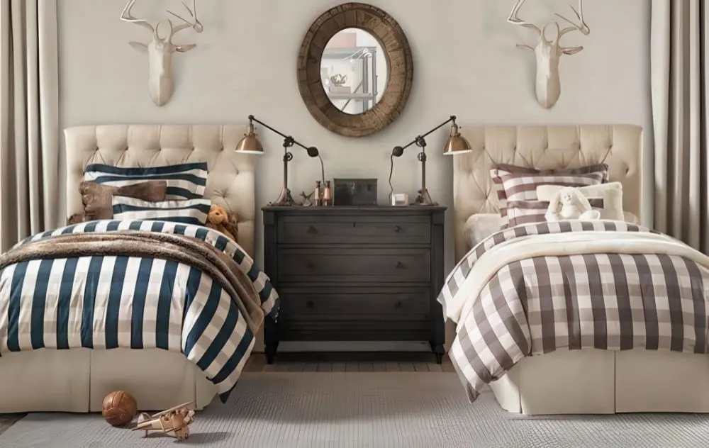 A cozy yet refined twin bedroom featuring tufted headboards, buffalo plaid bedding, and natural textures. Leather accents, wood furniture, and mounted antlers enhance the rustic aesthetic.