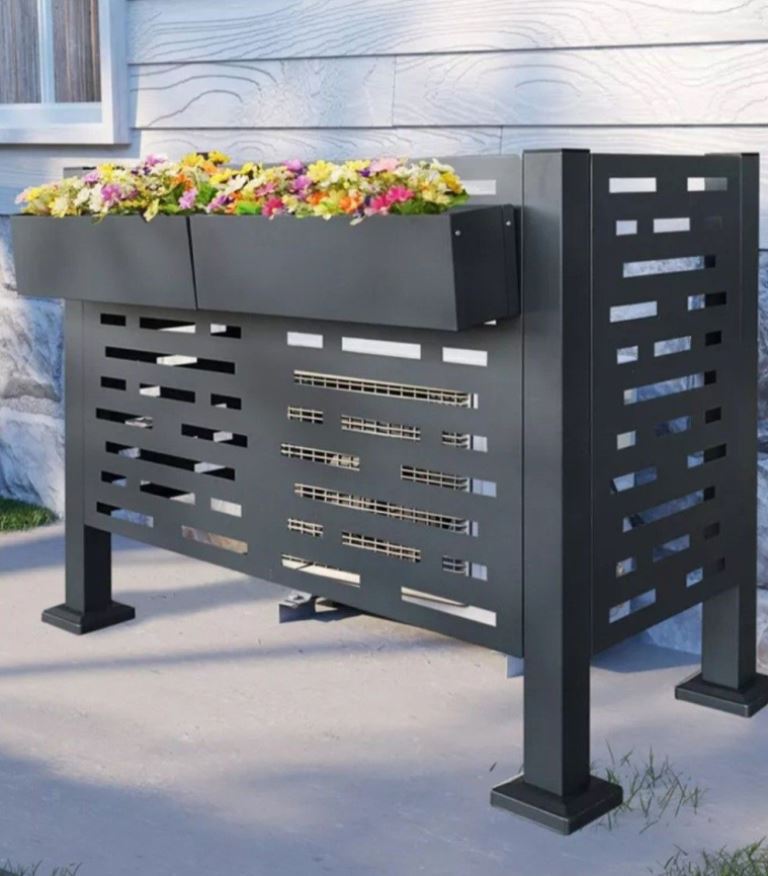This black metal cover on legs is decorated with a planter to make it look eye-catching and bold.