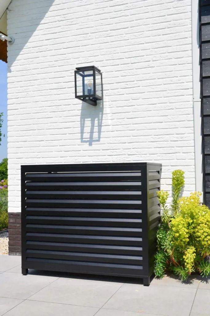 This black metal cover is a nice solution for outdoors: it's durable and sleek, perfect for a modern space.