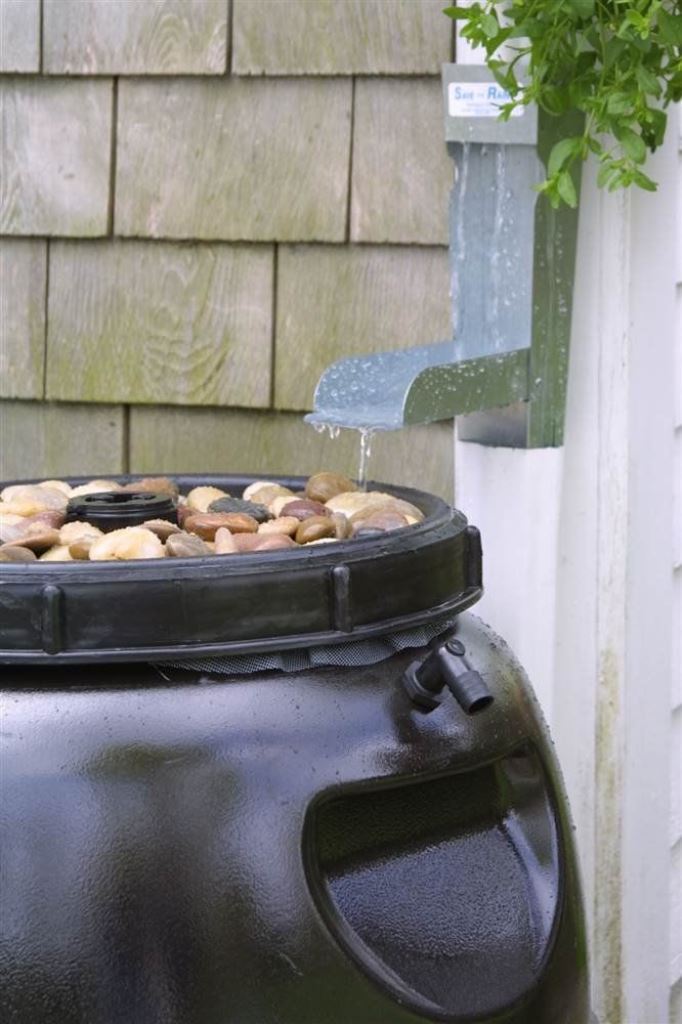 This black container is topped with pebbles to produce less sound during rain.