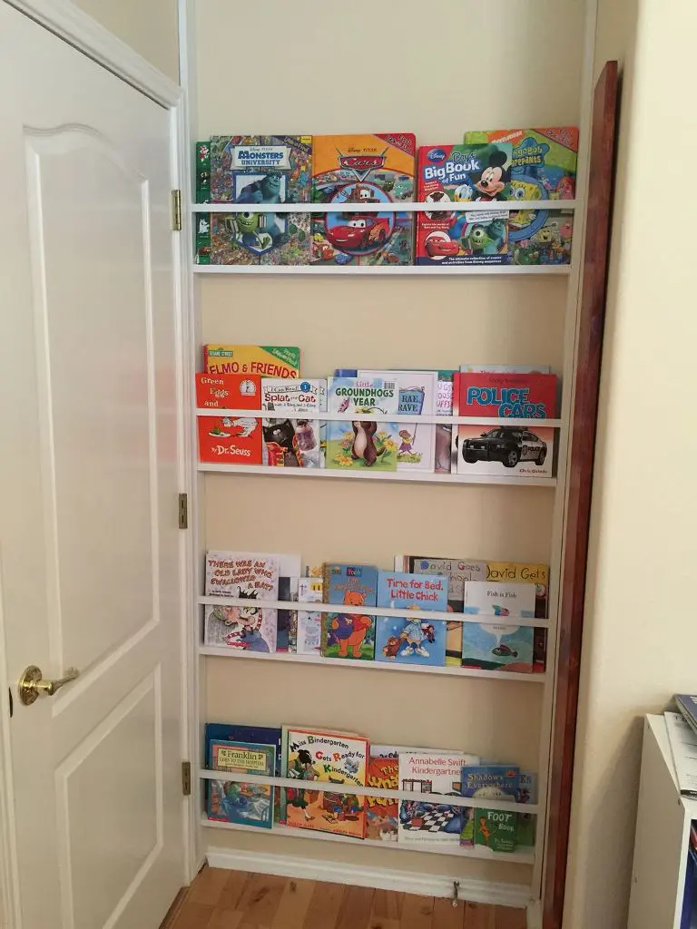 This awkward nook is done with ledges to place kids' books, and it's a great idea for using this small amount of space.