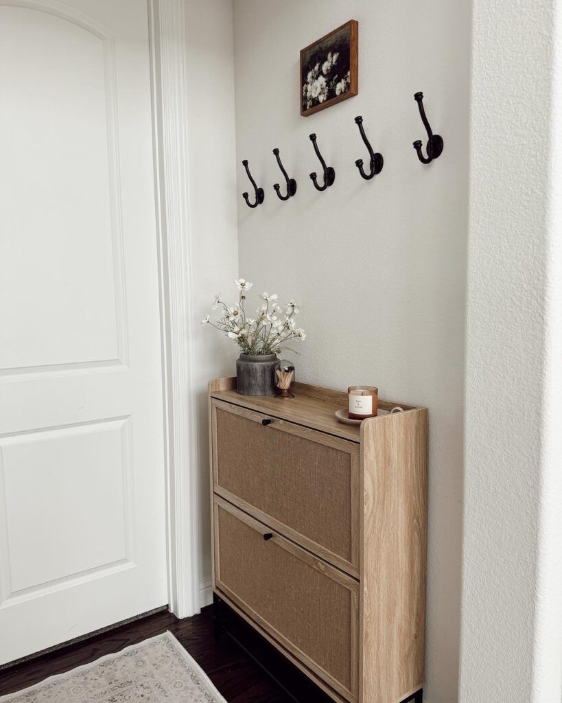 Not only shelves but also elegant cabinets can be placed in entryways behind the door.

(via thegentlealbum).