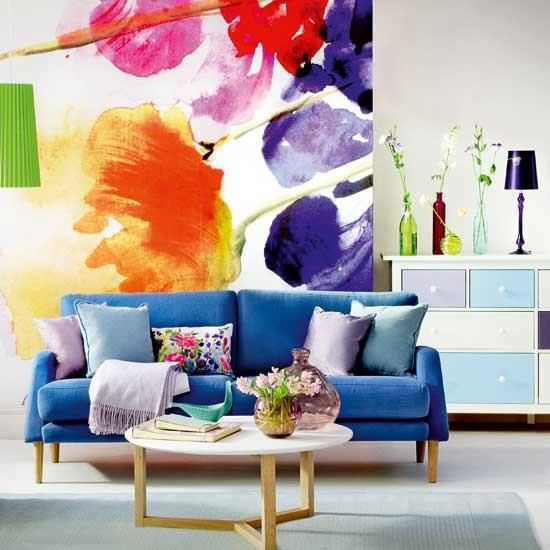 A super bright floral artwork and matching bright pillows for a bold summer feel in the living room.