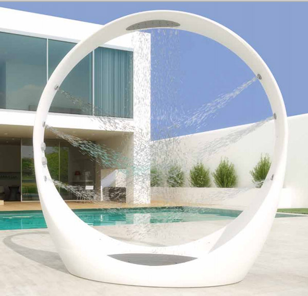 A unique and ultra-modenr outdoor round shower with shower heads built-in all around is a veyr fresh and bold idea.