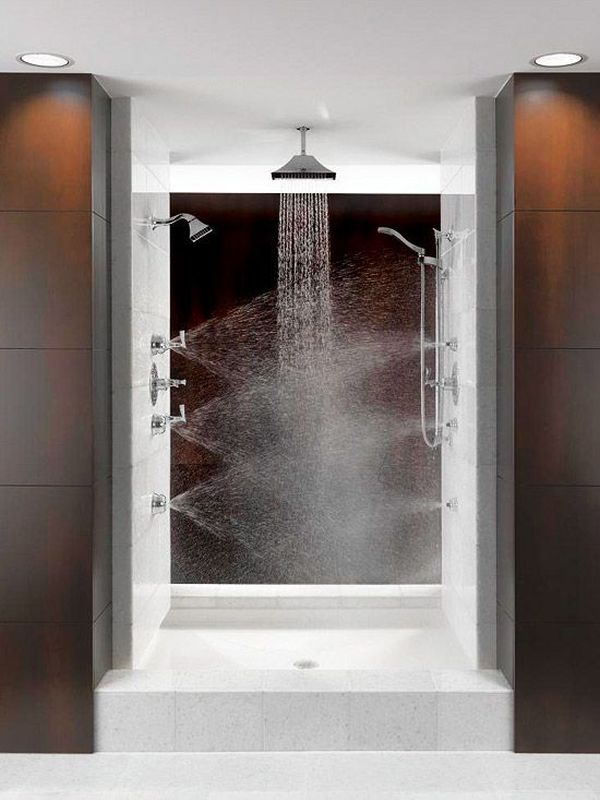 A bold and catchy shower space with a rain shower and shower heads integrated into the wall for massage.