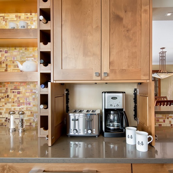 A mini cabinet with a coffee machine and a toaster under an upper cabinet will keep your small kitchen neat and decluttered.