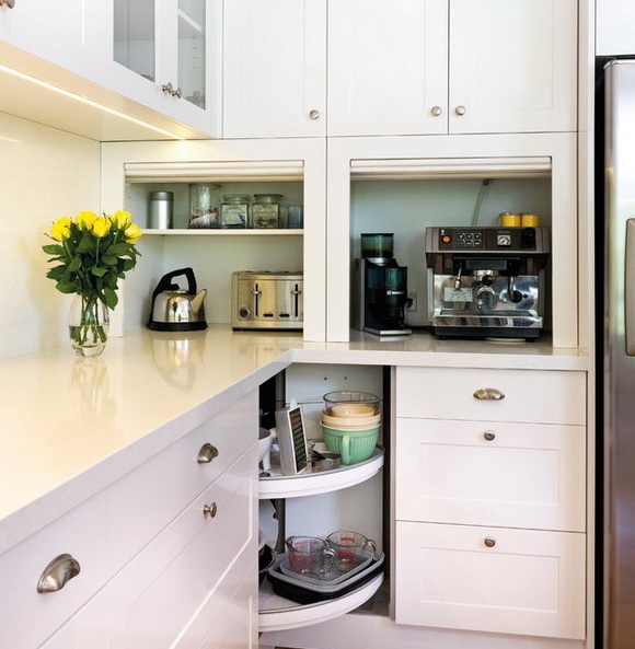 Two mini cabinets with various appliances and jars is a cool idea to hide appliances when not in need.