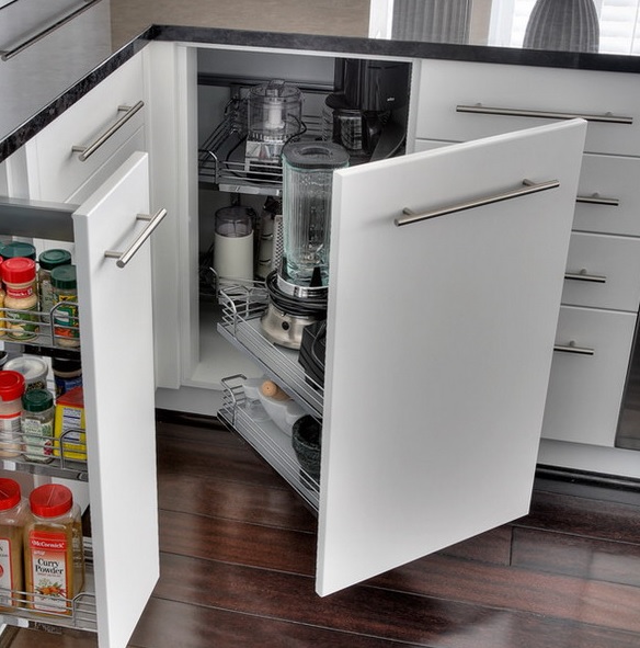 A corner cabinet with usual and retractable shelves, jars, appliances and other stuff.