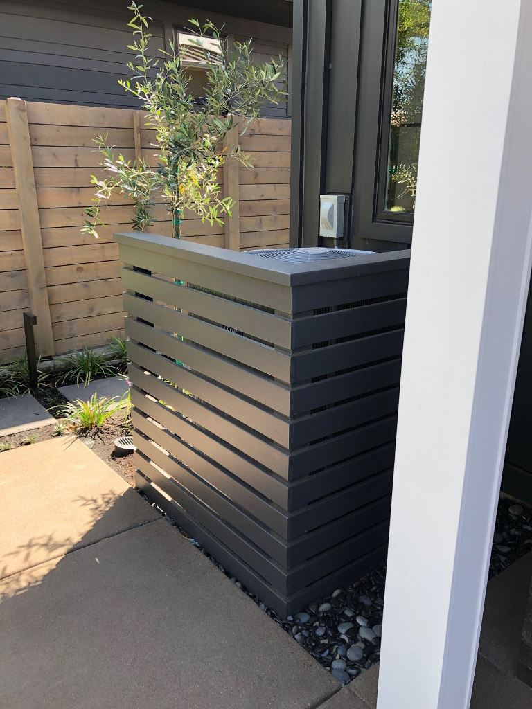These dark slatted screens perfectly match the exterior of the house.