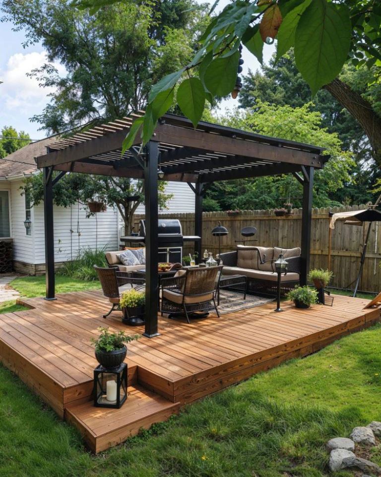 This small deck is finished off with a dark pergola, and modern furniture composes an outdoor living room with a grill.