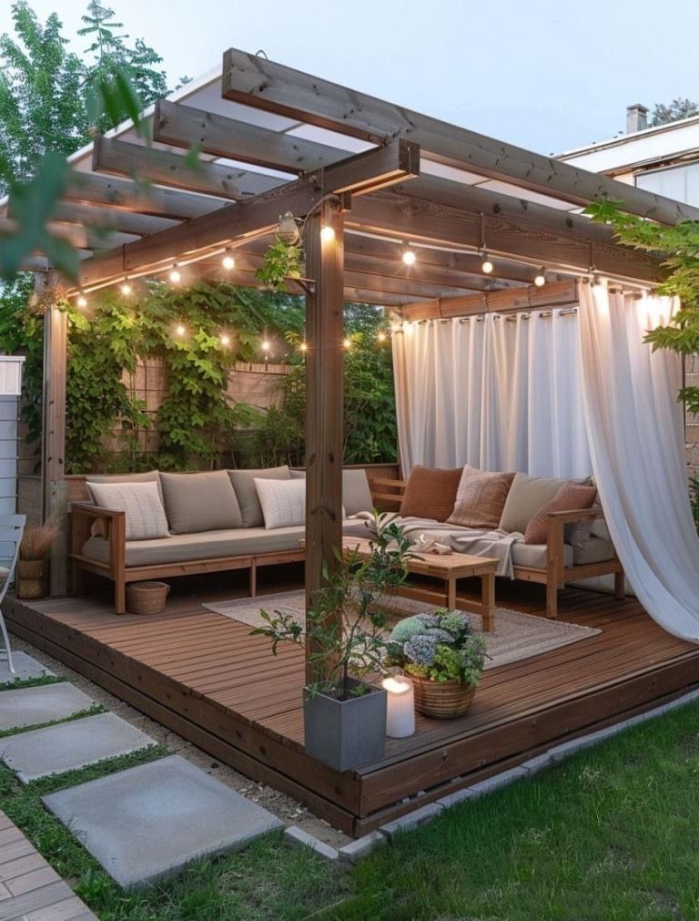 This dreamy space is styled with curtains and lights to bring more privacy and to make up a cozy spot.