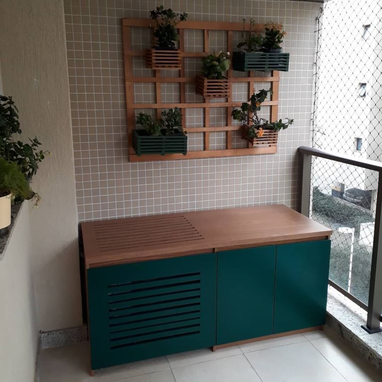 This balcony cabinet hides an AC unit and can work as a table or a seat.