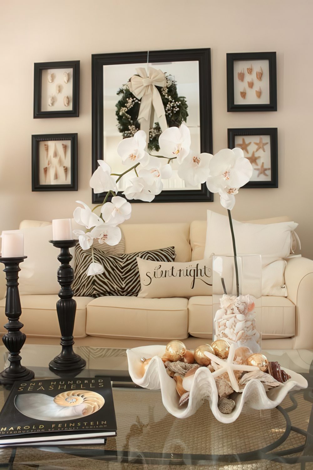A gorgeous centerpiece with a white orchid and a large seashell with smaller ones and starfish is a chic idea for your home.