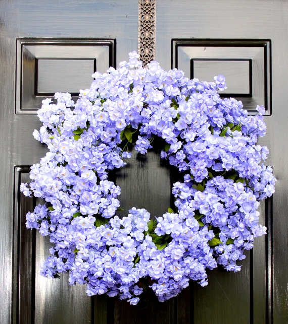 A super colorful purple bloom wreath will make your front door feel like summer, bold and bright.