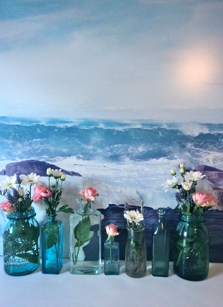 Blue jars and bottles with pink, white and purple blooms will make your space very relaxed and summer-infused.