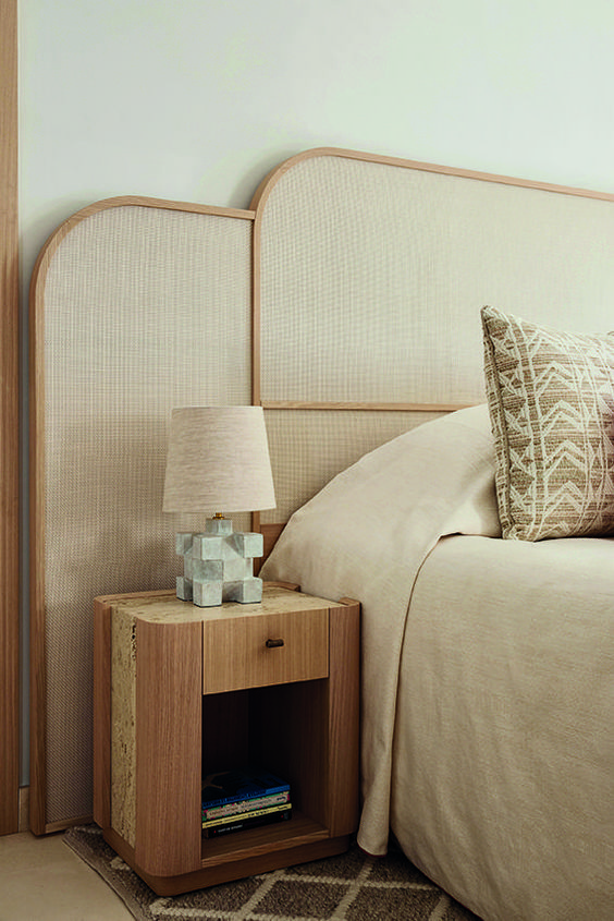 The bed is accented with an upholstered panel headboard for a textural touch and lovely look.