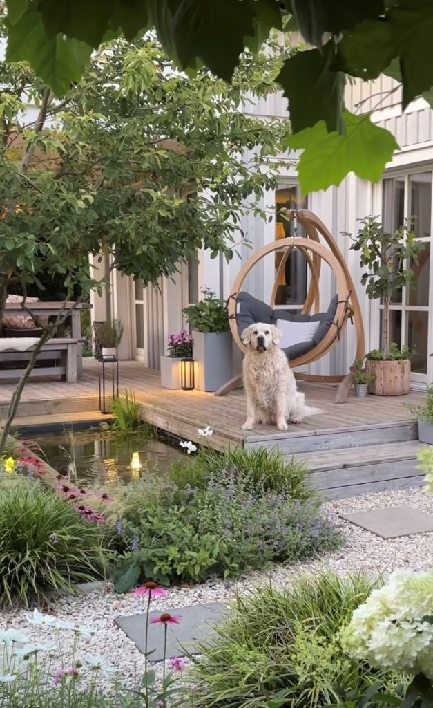 The small deck is placed at the house to extend the spaces outdoors, and there's a pond and contemporary garden around.