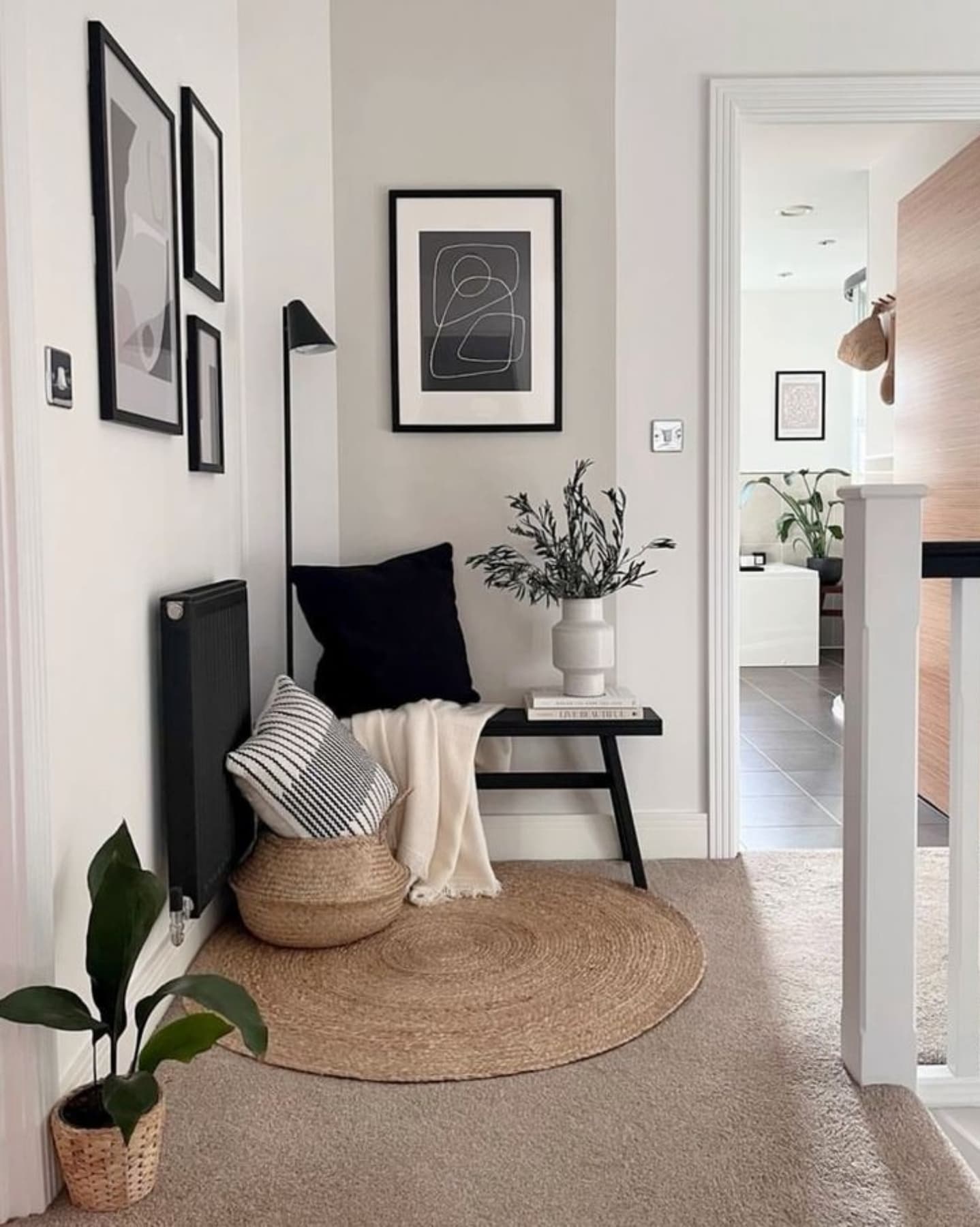 This cozy corner gets an instant glow-up with a slim floor lamp and layered textures—perfect proof that even the most awkward spots can feel intentional.

(@esraa_zaki_interiors).