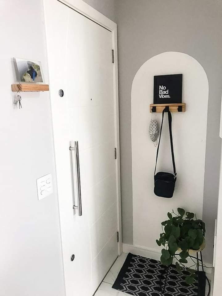 This tiny wall rack is good for hanging handbags, and it doesn't take floor space at all.