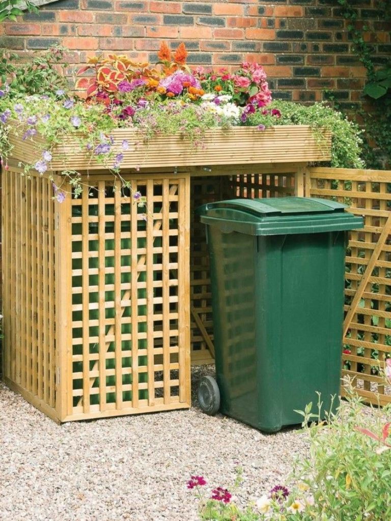 The stained lattice box doesn't look too heavy and the tray on top shows off bright flowers.