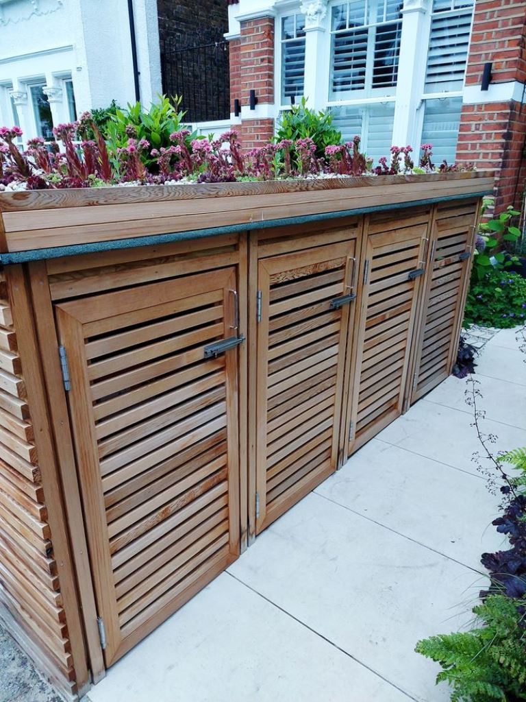 The large box of four compartments is stained, and the tray on top features blooms and greenery.
