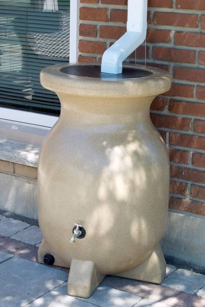 A large neutral stone container with a faucet is a modern solution, a nice alternative to a usual barrel.