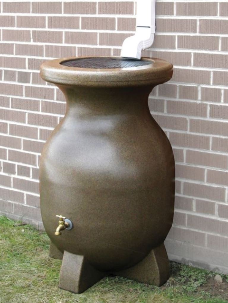 This large stone container with a faucet is a cool solution for outdoors, it gathers rain water and adds style.