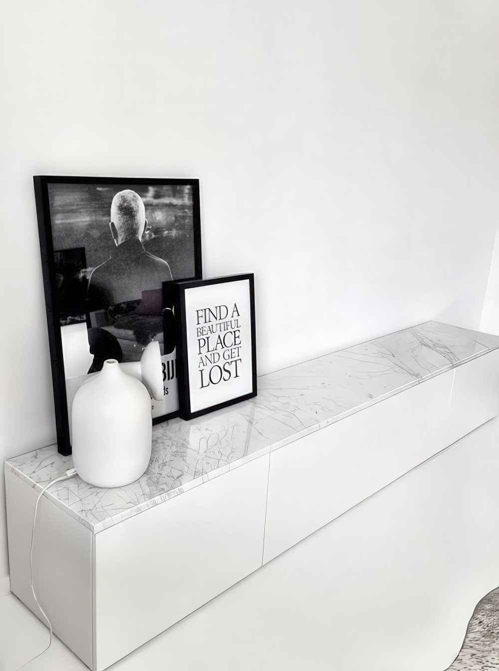 Short IKEA Besta unit on a floor.