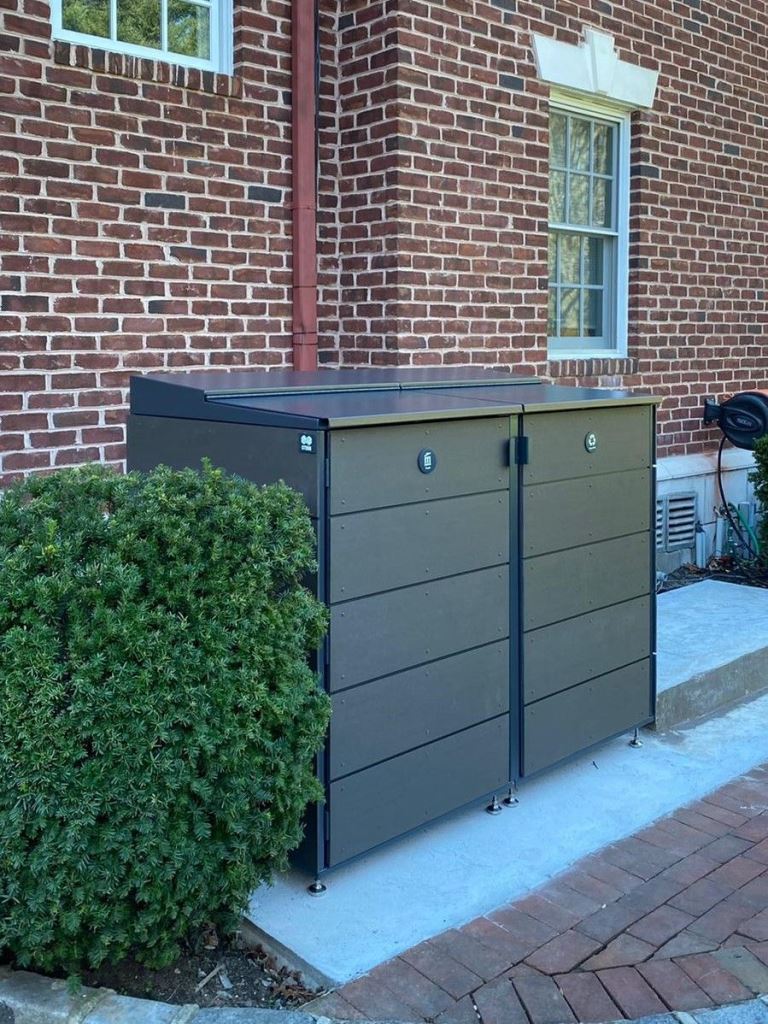 These sleek wood and metal boxes in black are a stylish and refined solution for a modern outdoor space.